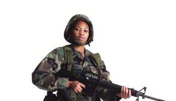 a young african american female soldier stand in fatighues with her gun