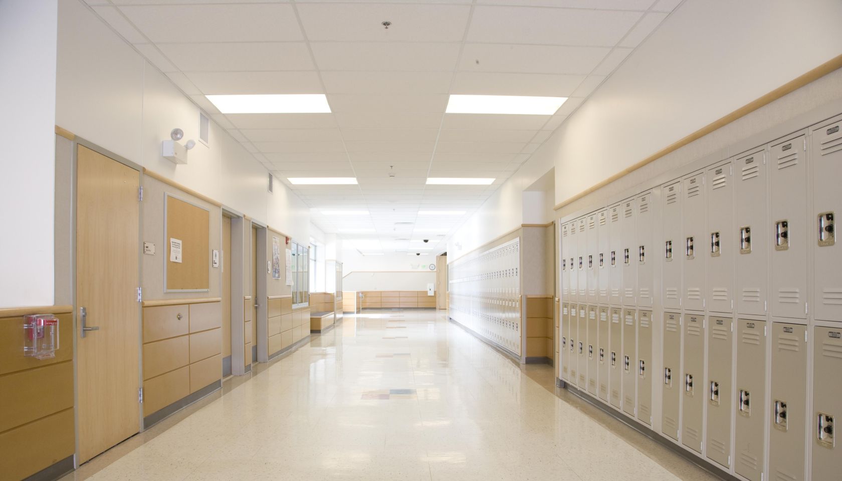 Lockers in empty high school corridor