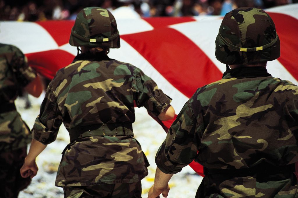 Soldiers with American flag in parade