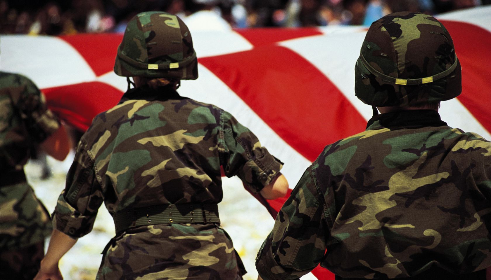Soldiers with American flag in parade