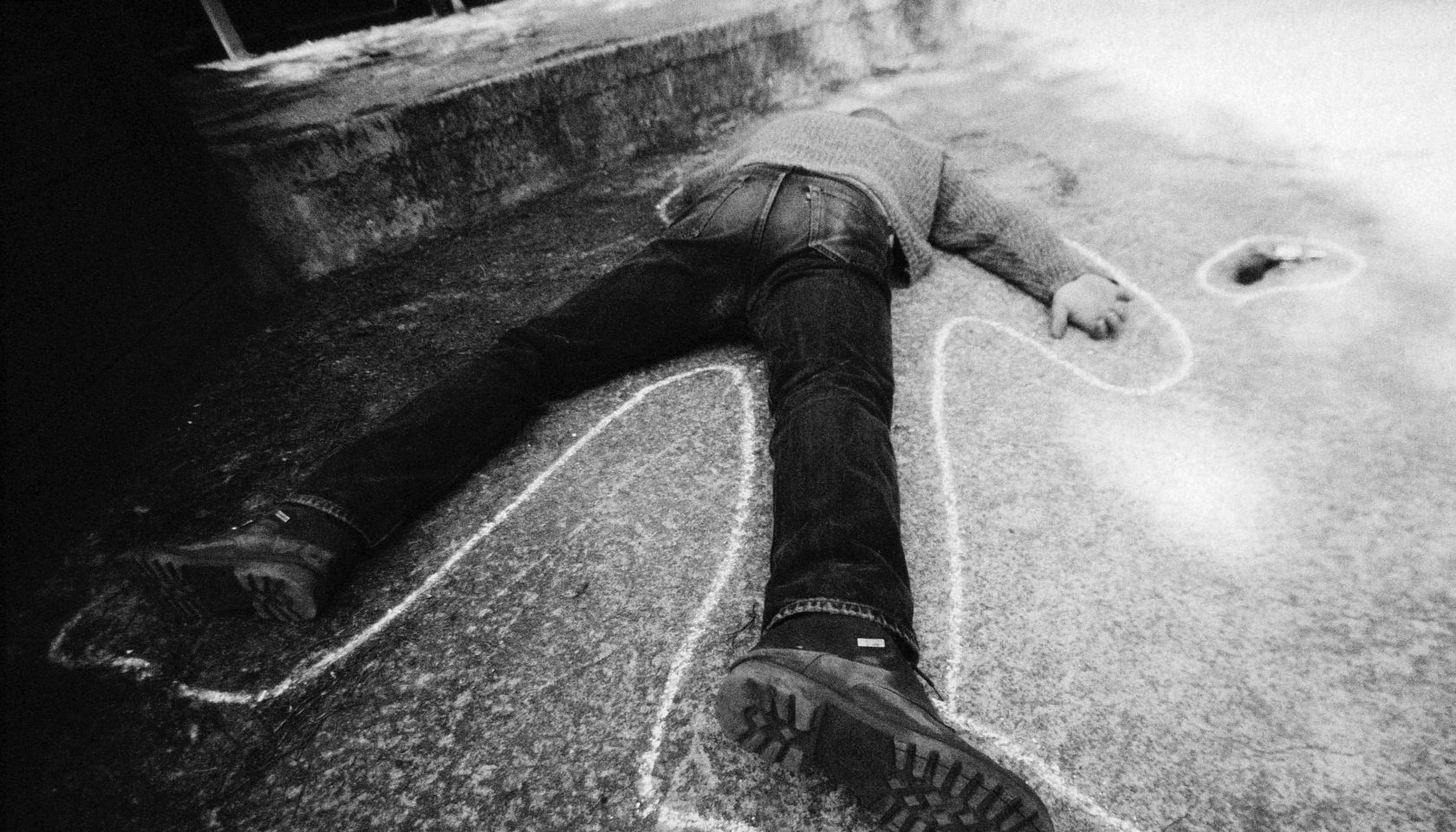 Dead man on ground, b&w