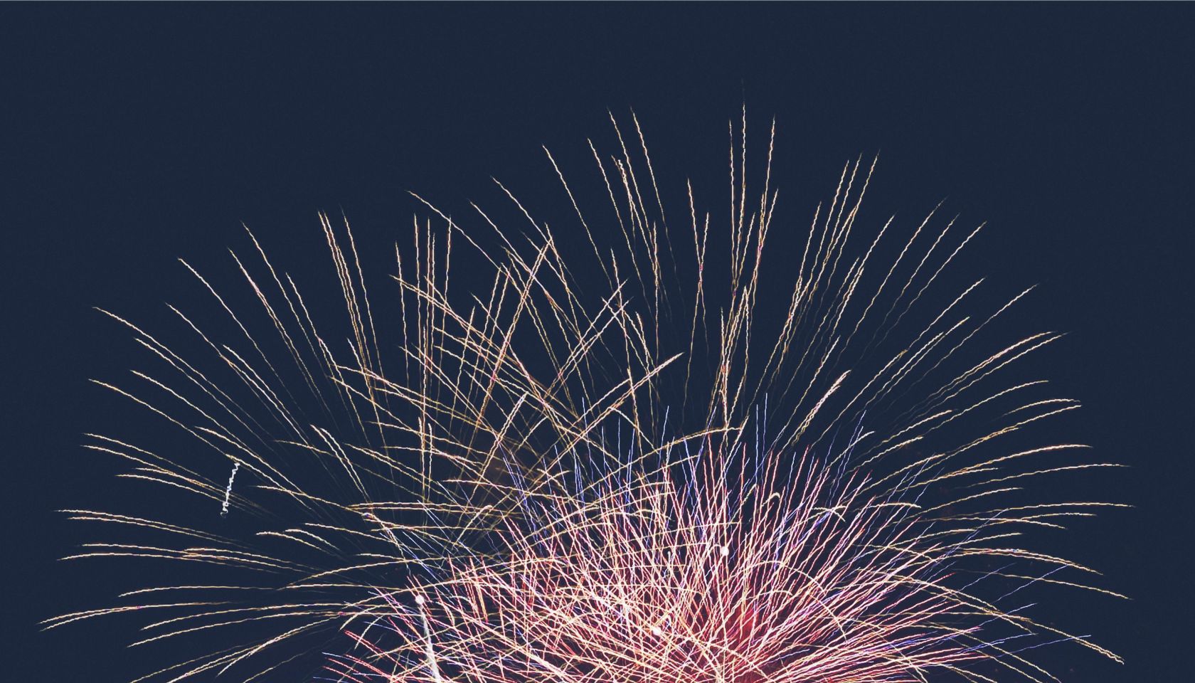Fourth of July celebration over New York skyline at night