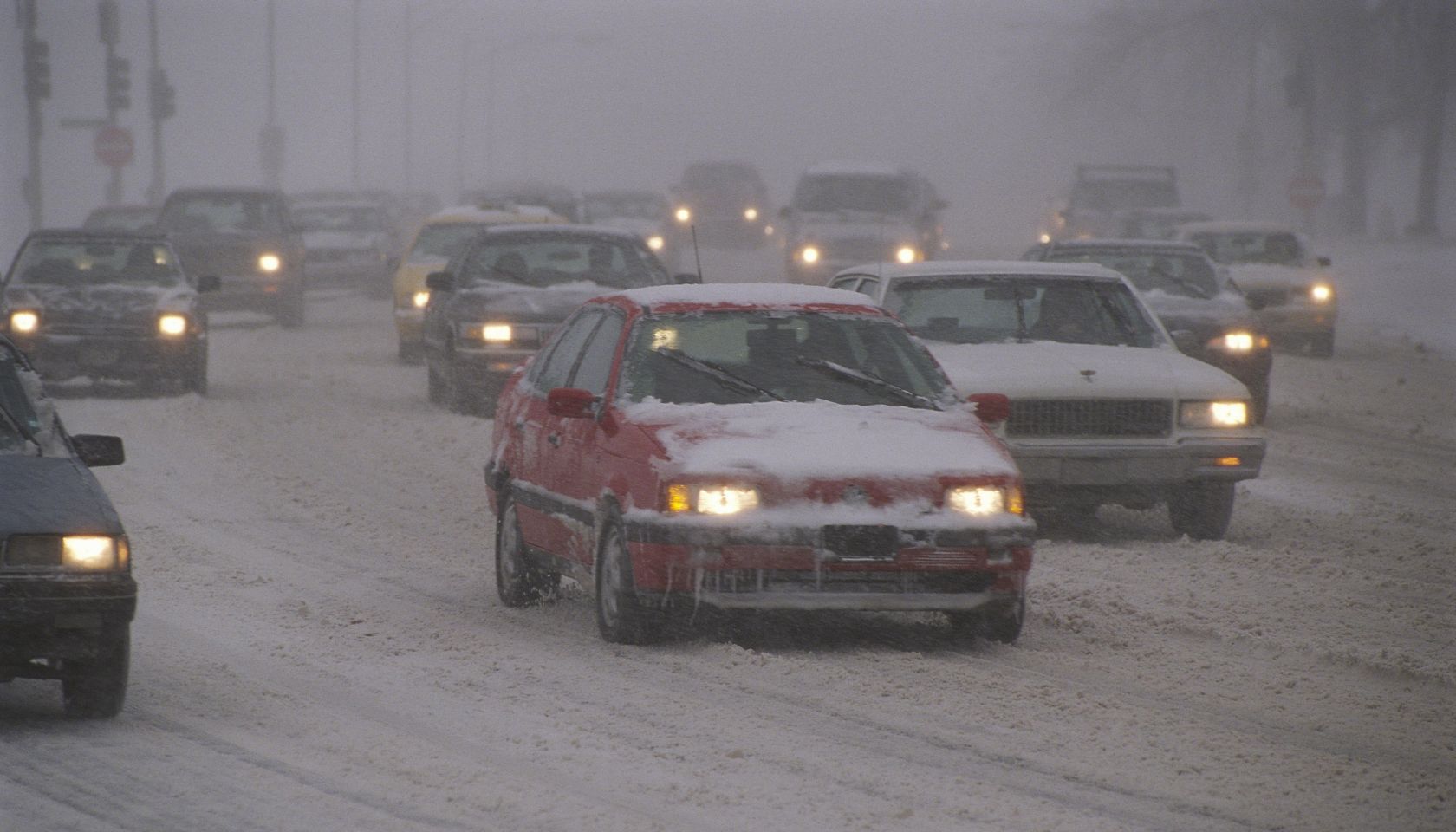 Traffic driving in snowstorm