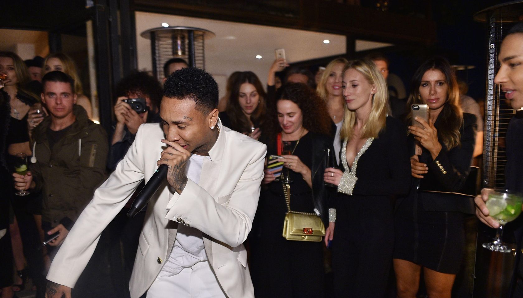 Tyga surprised Balmain's creative director, Olivier Rousteing, with a live performance at his 30th birthday celebration