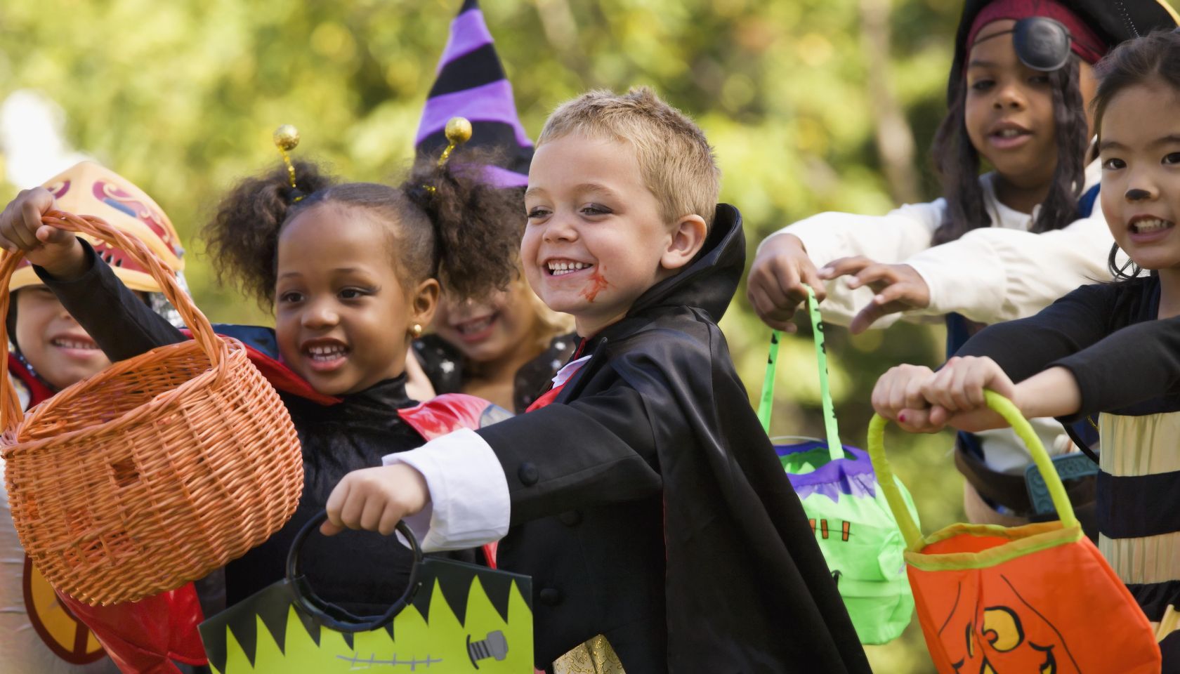 Multi-ethnic children dressed in Halloween costumes