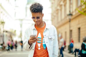 Young man using phone in the city