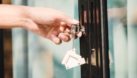 Landlord unlocks the house key for new house
