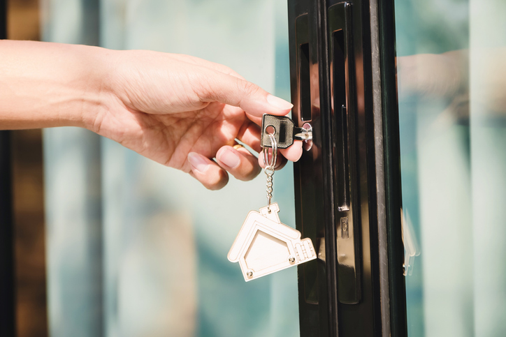 Landlord unlocks the house key for new house