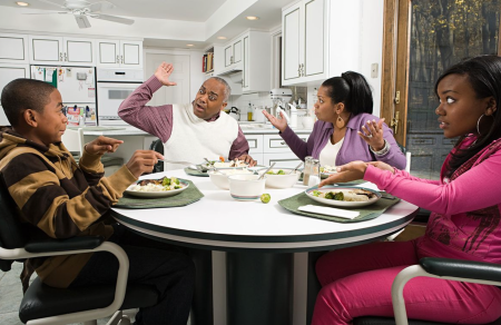 African American Family Arguing At Table