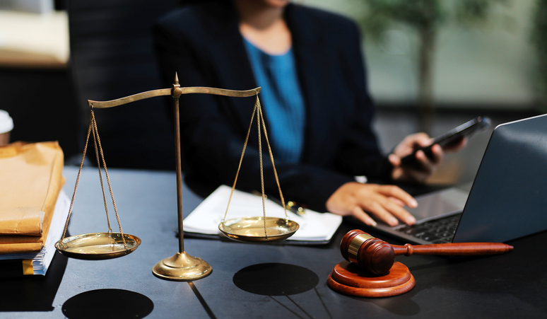 female business woman lawyers working at the law firms. Judge gavel with scales of justice. Legal law, lawyer, documents, advice and justice concept.
