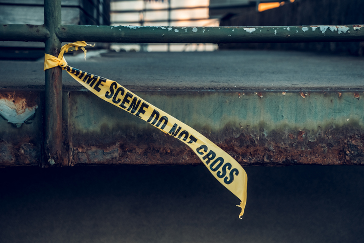 Crime Scene Tape on Rusted Urban Loading Dock