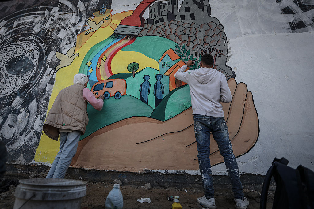 Young Palestinian artists paint hopeful graffiti amid Gaza ruins