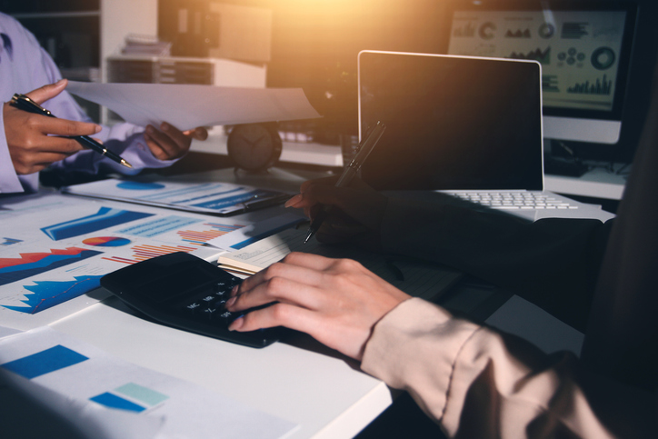 Above table with finance papers, graphs and big data during teamwork meeting with accounting or marketing team discussing budget, strategy or growth development. Closeup of SEO team doing research