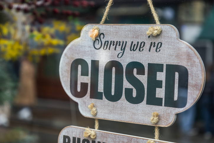 Wooden Closed Sign Hanging on Store Door Entrance