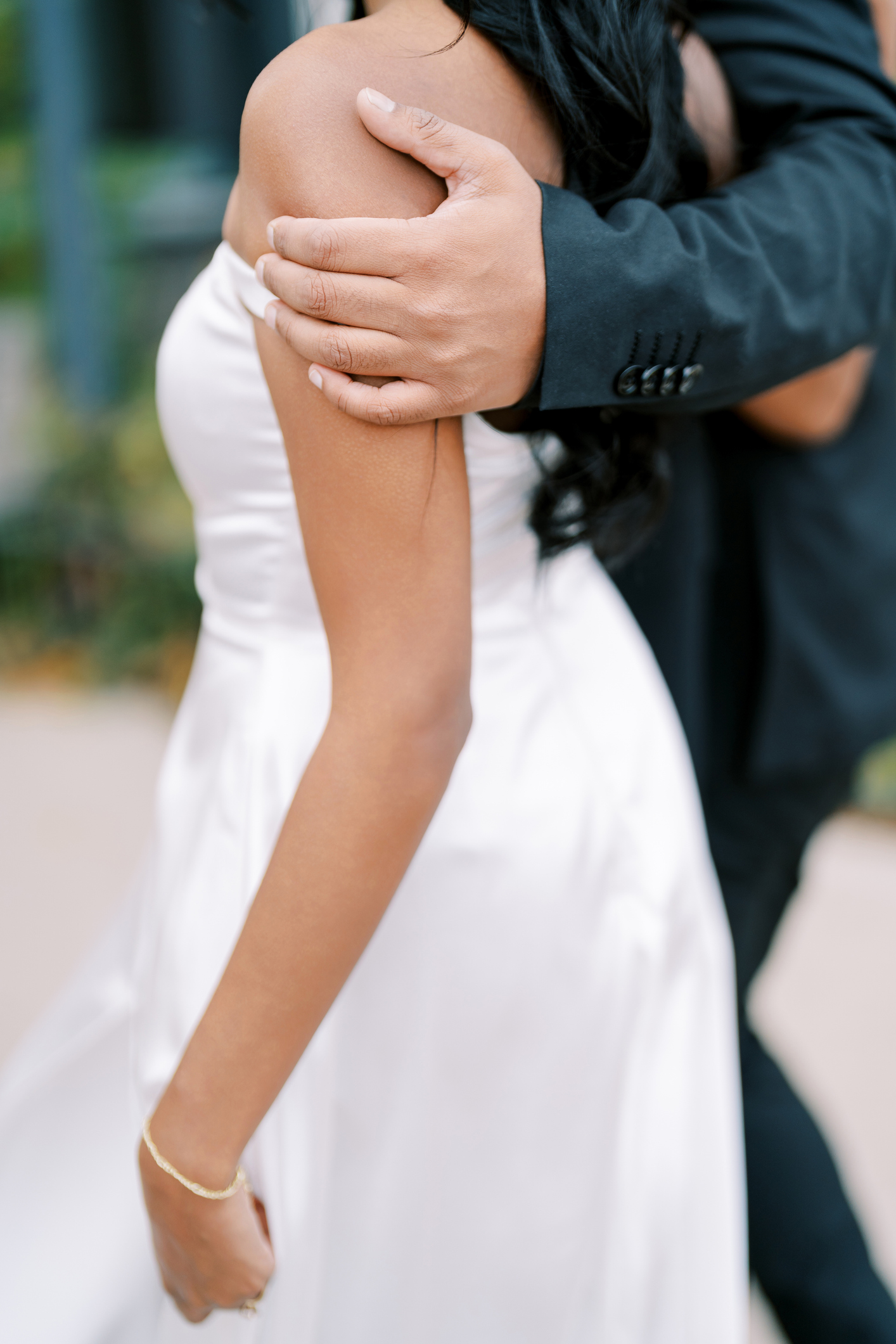 Cherished jewelry accentuates intimate bride and special occasion. Close and heartfelt scene showing bride embracing her cherished jewelry accessories